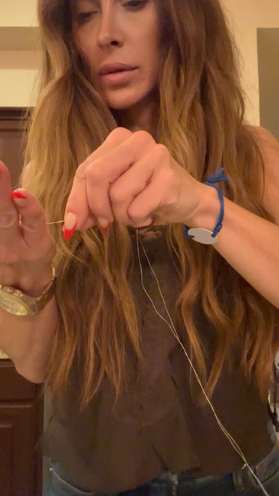 Close-up of beaded watercolor mini painting with metallic thread detail