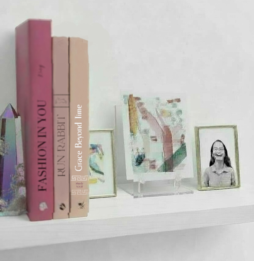 mini abstract watercolor painting embroidered with seed beads on a bookshelf